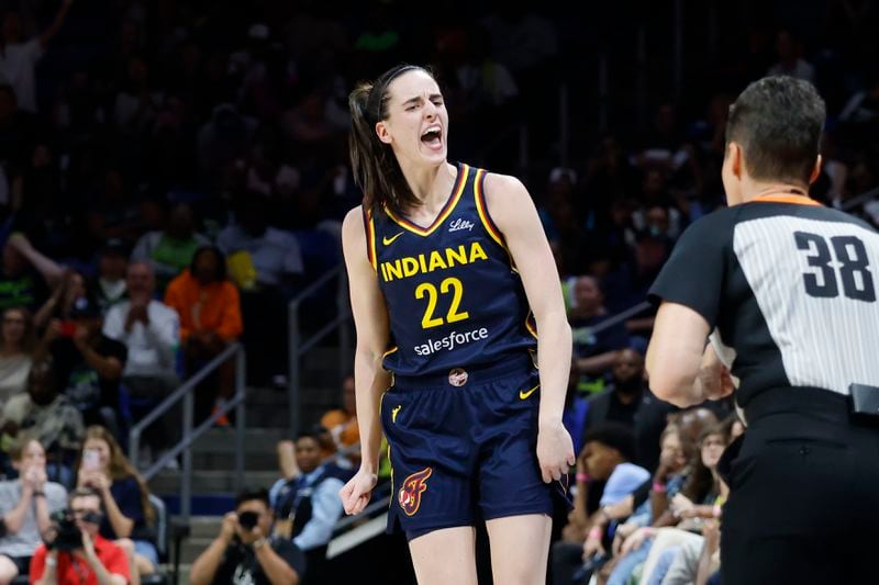 Indiana Fever guard Caitlyn Clark (22) reacts after making a three-point shot against the Dallas Wings during the first half of an WNBA basketball game in Arlington, Texas, Friday, May 3, 2024. (AP Photo/Michael Ainsworth)