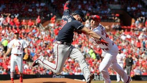 St. Louis Cardinals first baseman Paul Goldschmidt (46) misses the tag on Atlanta Braves third baseman Josh Donaldson (20), during Game 4 of best-of-five National League Division Series at Busch Stadium in St. Louis on Monday, October 7, 2019. (Curtis Compton/ccompton@ajc.com)