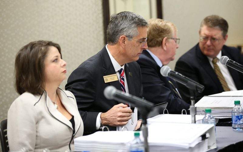 State Election Board members prepare for an emergency hearing at the Georgia Center for Continuing Education in Athens, Ga., on Wednesday, March 11, 2020. The hearing will decide whether Athens election officials broke state laws when they switched to paper ballots filled out by hand. [Photo/Austin Steele for the Atlanta Journal Constitution)
