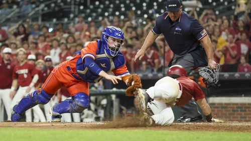 Parkview catcher Ethan Finch, left, tags out Lowndes’ Carson Page at home plate to end the fourth inning in game one of the GHSA baseball 7A state championship at Truist Park, Tuesday, May 16, 2023, in Atlanta. Lowndes won 3-2. (Jason Getz / Jason.Getz@ajc.com)