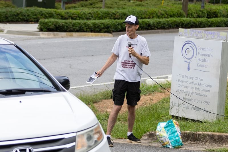 Protester Chris Chambers uses a loudspeaker while trying to discourage women from getting abortions while standing in front of the Feminist Women's Health Center in Brookhaven on Tuesday, August 23, 2022. (Steve Schaefer - The Atlanta Journal-Constitution)