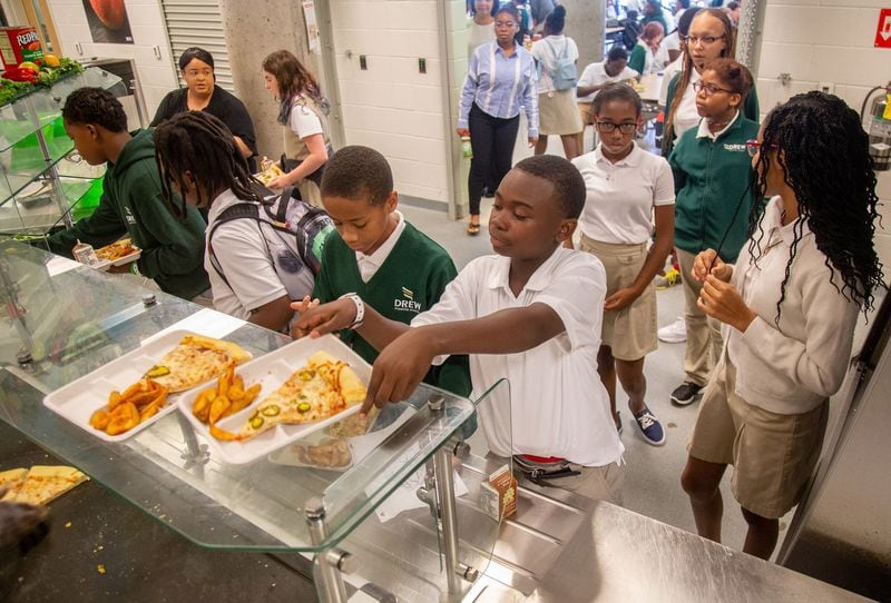 Students at Drew Charter School pick up their school lunch Friday, Aug. 9, 2019. STEVE SCHAEFER / SPECIAL TO THE AJC