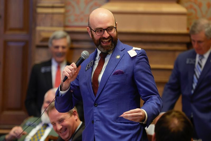Sen. Josh McLaurin (D-Sandy Springs) laughs after Sen. John Albers (R-Roswell)  throws paper on him after making an early motion to adjourn early on Sine Die at the State Capitol on Wednesday, March 29, 2023.  (Natrice Miller/ natrice.miller@ajc.com)