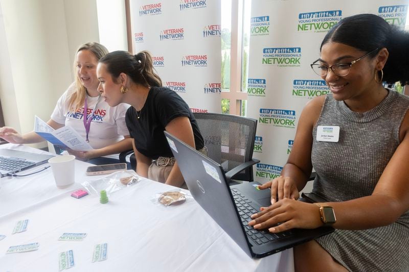 (From left) Brittany Gunter, Mattie Brazelton, and Jordyn Vargas, talk to potential future employers for Veterans Networks and Young Professionals Network at Jackson Healthcare HQ on Thursday, July 27, 2023 in Alpharetta. (Michael Blackshire/Michael.blackshire@ajc.com)