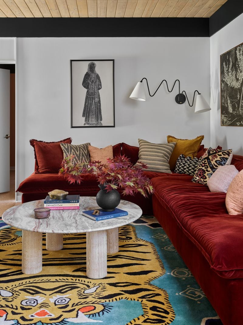 The red sofa and the modern twist on a Tibetan tiger rug are elements of Asian design that Jessica Davis has incorporated into her family's home in Buckhead.
(Courtesy of Atelier Davis / Emily Followill)