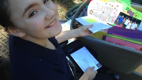 A month after his 10th birthday, Chase Howard of Marietta is still receiving cards from around the world. The cards came rolling in last month after his aunt posted a request for birthday greetings on her Facebook page. Chase has Duchenne Muscular Dystrophy, a rare and deadly genetic disorder. GRACIE BONDS STAPLES / GSTAPLES@AJC.COM