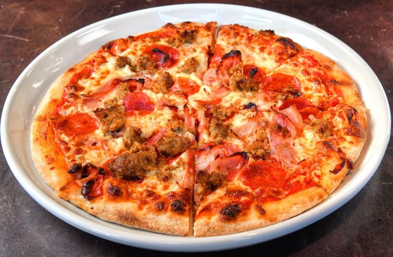Macellaio is a meat lover's pizza at Toscano. (Chris Hunt for The Atlanta Journal-Constitution)