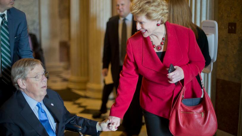 U.S. Sen. Debbie Stabenow, D-Mich., visits with U.S. Sen. Johnny Isakson, R-Ga., on Thursday after the GOP majority led a change to the Senate’s rules to lower the vote threshold for Supreme Court nominees. Isakson, who has been recovering at home in Marietta from two back surgeries, made a special trip to Washington for the vote and another vote expected Friday to confirm the Supreme Court nomination of Neil Gorsuch. (AP Photo/Pablo Martinez Monsivais)
