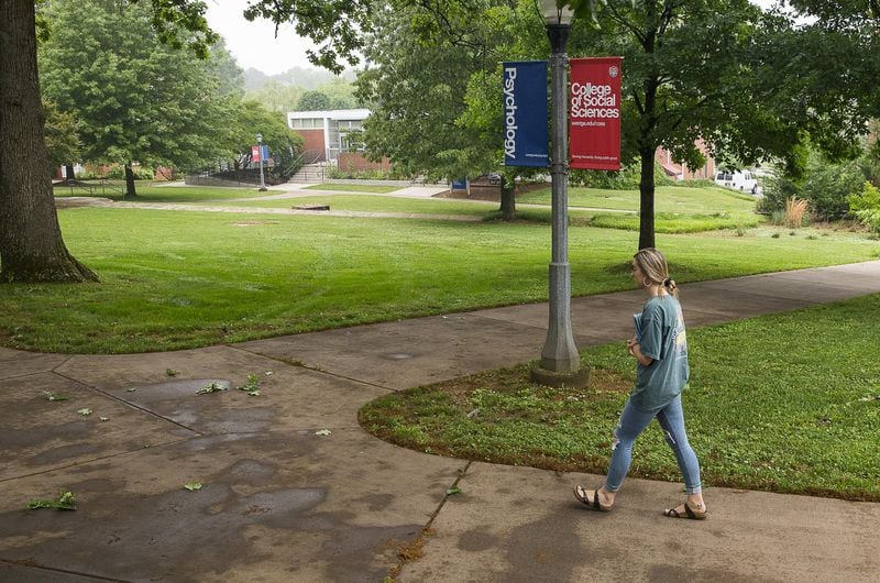 A woman walks the campus at the University of West Georgia in Carrollton in this AJC file photo. 