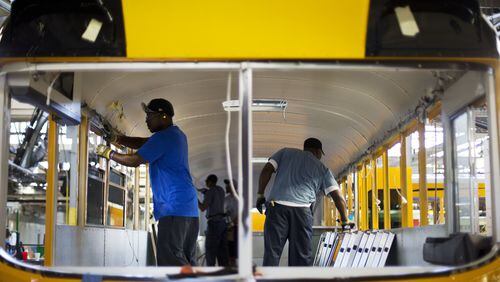 September 18, 2015: Employees work on a school bus on the assembly line at Blue Bird Corp.’s manufacturing facility in Fort Valley, Ga. Blue Bird Corp. is one of the nation’s leading manufacturers of school buses. (AP Photo/David Goldman)