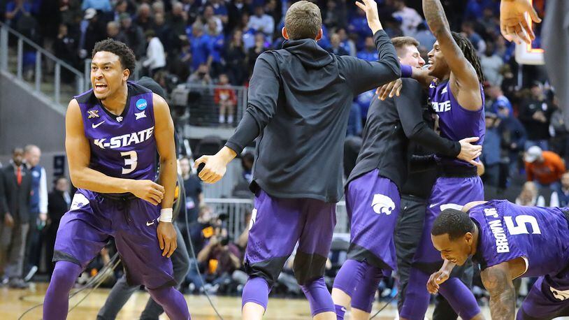 March 23, 2018 Atlanta: Kansas State guard Kamau Stokes and teammates celebrate beating Kentucky 61-58 in a regional semifinal NCAA college basketball game on Friday, March 23, 2018, in Atlanta.  Curtis Compton/ccompton@ajc.com
