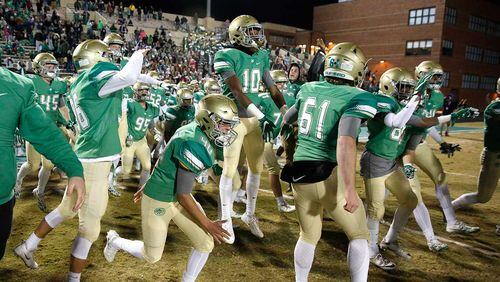 Buford players celebrate as time expires in Friday's state semifinal victory over Kell.