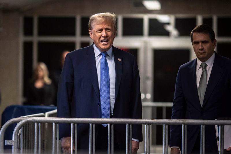 Former President Donald Trump, with his attorney Todd Blanche at his side, speaks with the media at the end of the day's proceedings in his trial at Manhattan criminal court , Friday, April 26, 2024, in New York. (Dave Sanders/The New York Times via AP, Pool)