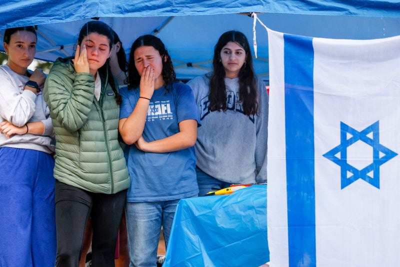 Students become emotional at a vigil for Israel at Emory University in Atlanta on Wednesday, October 11, 2023. The vigil comes after Hamas militants waged a surprise attack on Israel over the weekend. (Arvin Temkar / arvin.temkar@ajc.com)