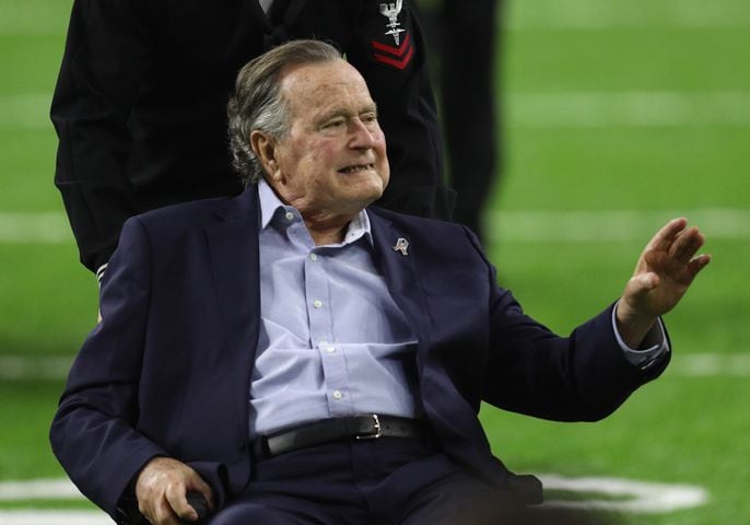 President George H.W. Bush flips coin at Super Bowl