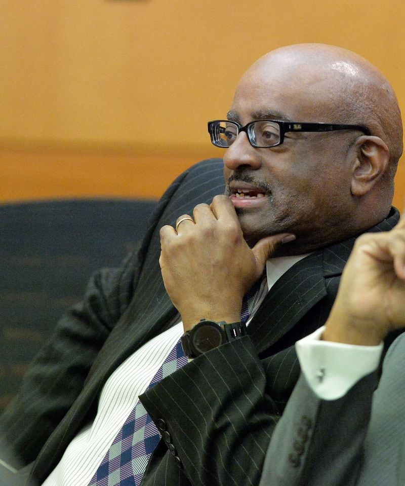  In this March 31, 2015 file photo, former APS SRT Director Michael Pitts and his defense attorney George Lawson talk as a jury question is announced in court Tuesday. A jury of six men and six women deliberate for a seventh day in the Atlanta Public Schools test-cheating trial on Tuesday, March 31, 2015. A quick verdict is unlikely as the jurors enter their second full week of deliberations as they sort through roughly five months of testimony against 12 former educators accused of engaging in a racketeering conspiracy to inflate test scores. 