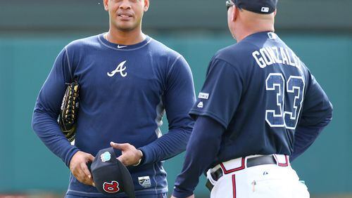 The arrest of Hector Olivera, left, contributed to the Braves' start and the eventual firing of manager Fredi Gonzalez, right. (AP photo)