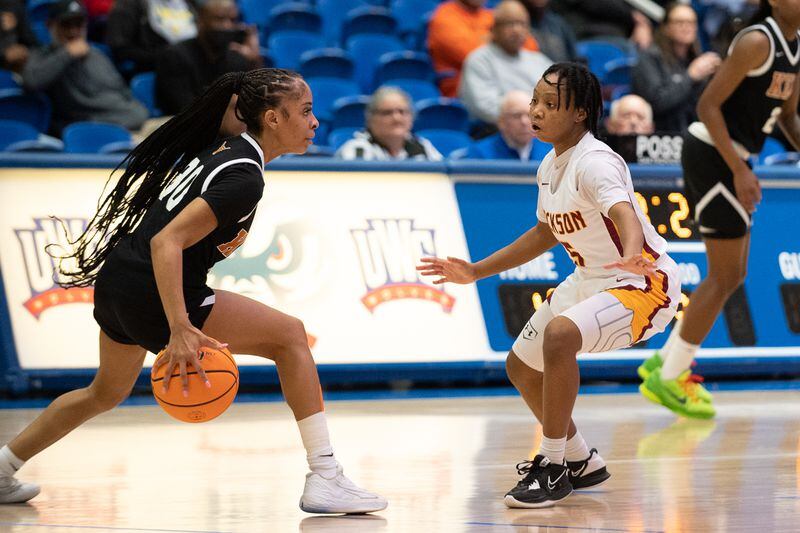 Crystal Henderson attempts to take the ball past Jackson's Maya Whitehead during the GHSA AAAAA girls Kell vs Jackson basketball semifinals playoff game at West Georgia College on March 3, 2023. Jamie Spaar for the Atlanta Journal-Constitution