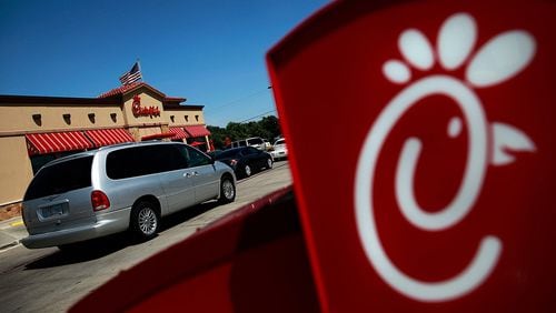 Drive through customers wait in line at a Chick-fil-A restaurant on August 1, 2012 in Fort Worth, Texas.