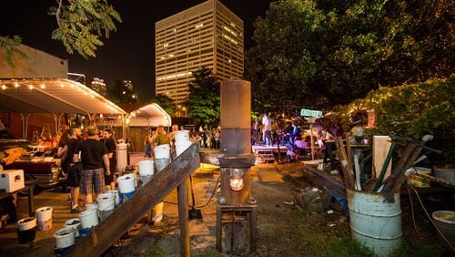 The Atlanta Metal Arts organization is at Castelberry Hill's Elliott Street Pub for a monthly iron pour.  Participants are invited to etch their own scratch blocks in iron before the molten metal is poured to make personal art and sculpture.  (Jenni Girtman / Atlanta Event Photography)