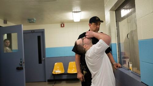 Inmates in Connecticut are allowed access to methadone treatment for opioid use disorder, but Georgia officials don’t have clear policies to determine if they can grant those under state supervision access to the medication, an audit report found. Dan Toce, a heroin addict, takes methadone at the New Haven Correctional Center in Connecticut, May 23, 2017. (Christopher Capozziello/The New York Times)