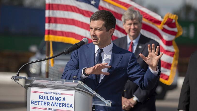 U.S. Transportation Secretary Pete Buttigieg speaks to the media during his visit to the Georgia Ports Authority's Megarail facility on Friday. Buttigieg's visit highlighted recent coordination with the U.S. Department of Transportation and the Georgia Ports Authority to improved its cargo flow by increasing rail capacity and activating flexible "pop-up" container yards near manufacturing and distribution centers. (AJC Photo/Stephen B. Morton)
