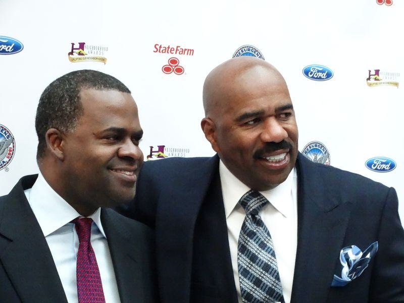 Atlanta mayor Kasim Reed and Steve Harvey pose after a press conference last week to officially announce the move of the Neighborhood Awards to Atlanta, good news for Reed after a tough week featuring the traffic jam of the century.