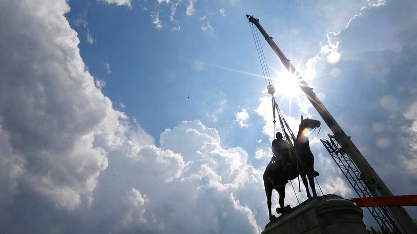 Work crews work to remove the statue of confederate general Stonewall Jackson, Wednesday, July 1, 2020, in Richmond, Va. Richmond Mayor Levar Stoney has ordered the immediate removal of all Confederate statues in the city, saying he was using his emergency powers to speed up the healing process for the former capital of the Confederacy amid weeks of protests over police brutality and racial injustice. (AP Photo/Steve Helber)