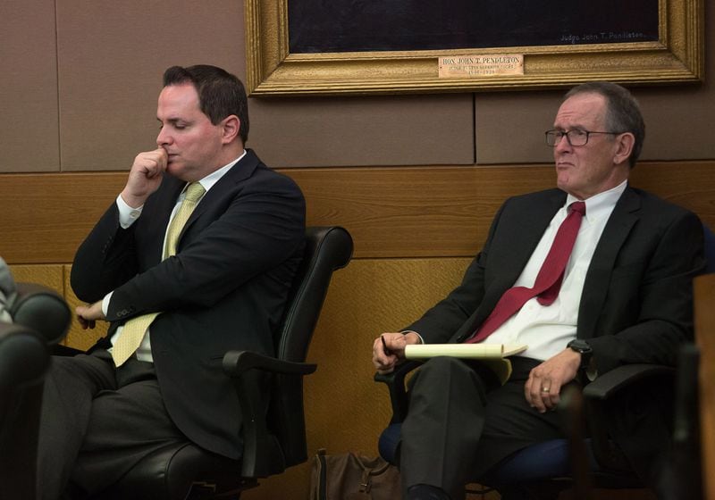 John Butters (left) and David Cohen listen to Mye Brindle testify in Fulton County Superior Court on Monday, April 9, 2018. Butters and Cohen — the lawyers whom Brindle retained for her 2012 civil lawsuit against Waffle House chairman Joe Rogers Jr. — are Brindle’s co-defendants in this criminal trial. (STEVE SCHAEFER / SPECIAL TO THE AJC)