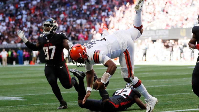 Browns quarterback Jacoby Brissett goes airborne as he crosses the goal line for his team's first touchdown during the second quarter against the Falcons on Sunday in Atlanta. (Miguel Martinez / miguel.martinezjimenez@ajc.com)
