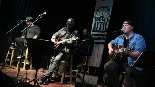 Kristian Bush (center) was joined by Wyatt Durrette (left) and Chris Gelbuda (right) at the first of four concerts at Eddie's Attic Nov. 26-27, 2017. Photo: Melissa Ruggieri/AJC