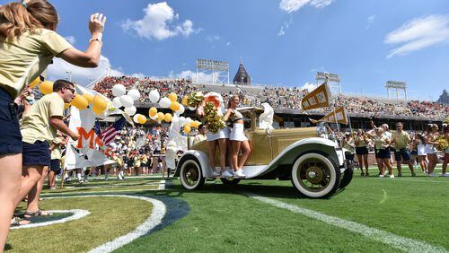 September 10, 2016 Atlanta - Georgia Tech's Ramblin' Wreck leads the band, cheerleaders, Buzz, players, and coaches before the start of the Georgia Tech home opener against against the Mercer on Saturday, September 10, 2016. HYOSUB SHIN / HSHIN@AJC.COM