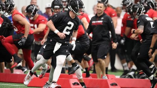Falcons quarterback Matt Ryan leads the team through an agility drill during organized team activities on Tuesday, May 22, 2018, in Flowery Branch.   Curtis Compton/ccompton@ajc.com