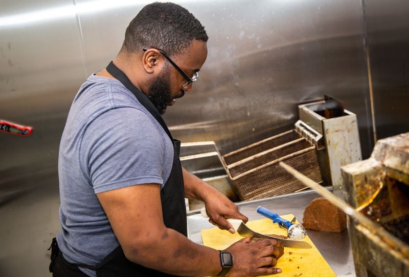 Terry Sargent prepares his vegan barbecue in a cloud kitchen in Decatur. (Ryan Fleisher for The Atlanta Journal-Constitution)