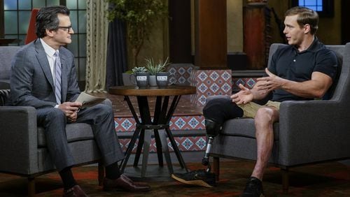 Eric Hunter lost a leg in Afghanistan and almost lost hope at Walter Reed, but fellow wounded veterans helped bring him back. He is seen here with Turner Classic Movies host Ben Mankiewicz. Hunter chose “The Green Berets” for this weekend’s TCM lineup. CONTRIBUTED BY TURNER CLASSIC MOVIES
