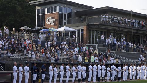 Georgia Tech players stand outside of their dugout for the U.S. national anthem before their game against Auburn at Russ Chandler Stadium, Tuesday, May 7, 2024, in Atlanta. (Jason Getz / AJC)

