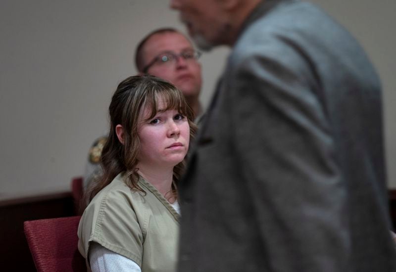Hannah Gutierrez-Reed watches her father Thell Reed leave the podium after he asked the judge not impose prison time on his daughter, during a sentencing hearing in Santa Fe, New Mexico, on Monday April 15, 2024. Gutierrez-Reed, armorer on the set of the Western film "Rust," was convicted in March of involuntary manslaughter in the death of cinematographer Halyna Hutchins, who was fatally shot by Alec Baldwin in 2021. Gutierrez Reed was sentenced to 18 months in prison. (Eddie Moore/The Albuquerque Journal via AP, Pool)