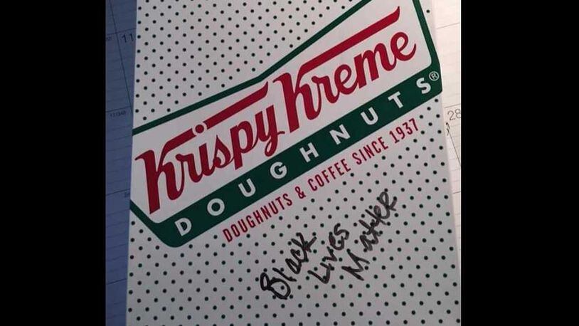 An image, posted by pro-police blog Blue Lives Matter, supposedly of a Krispy Kreme doughnut box received by a Smyrna police officer ordering from the South Cobb Drive location.