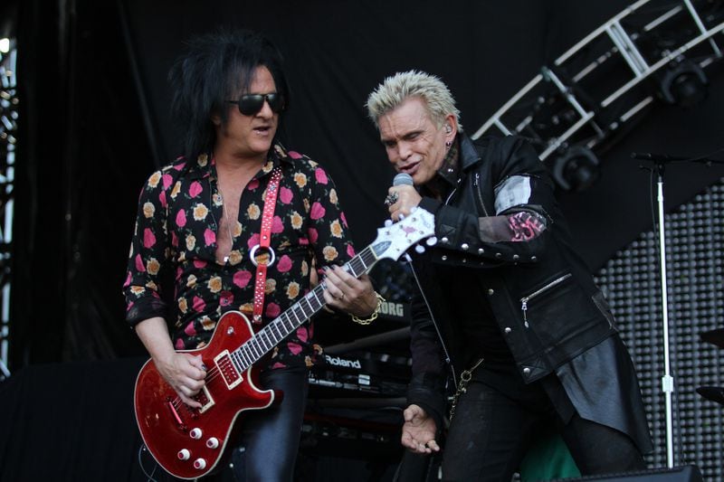 Billy Idol with lead guitarist Steve Stevens perform on the final day of the annual Music Midtown music festival. (Akili-Casundria Ramsess/Special to the AJC)