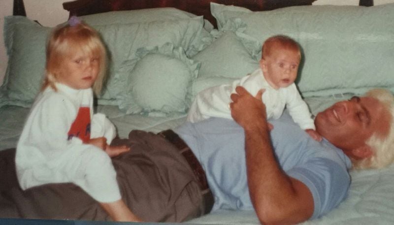 Ric Flair and children Ashley and Reid, 1998. Flair says he moved to Atlanta because of The Charlotte Observer’s coverage of his son Reid’s heroin overdose death in 2013. Ashley is a wrestler who goes by the name Charlotte Flair. CONTRIBUTED BY RIC FLAIR