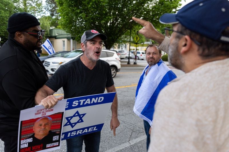 Supporters of Israel confront a Pro-Palestine protestor in Atlanta on Thursday, April 25, 2024. (Arvin Temkar / AJC)