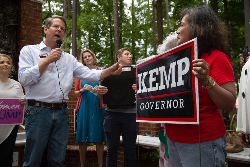 Secretary of State Brian Kemp talks to a small crowd at a rally at the Roswell City Hall Sunday, July 22, 2018. STEVE SCHAEFER / SPECIAL TO THE AJC