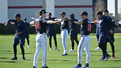 Atlanta Braves starting pitcher Max Fried (left) and starting pitcher Spencer Strider talk as they warm up during Braves spring training at CoolToday Park, Saturday, Feb. 18, 2023, in North Port, Fla.. (Hyosub Shin / Hyosub.Shin@ajc.com)
