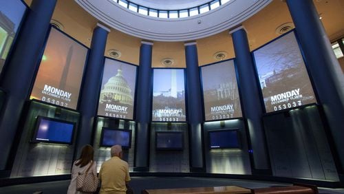 FILE ART: A couple watches a video inside the museum at the Carter Presidential Library in Atlanta on Aug. 15, 2015. BRANDEN CAMP / SPECIAL