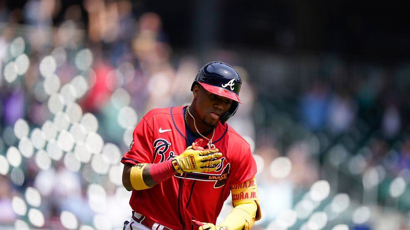 Braves outfielder Ronald Acuna (13) runs after hitting a home run in the fifth inning Thursday, April 15, 2021, against the Miami Marlins at Truist Park in Atlanta. (Brynn Anderson/AP)
