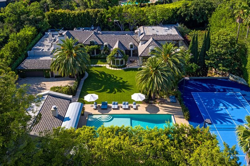 

Set on 1.25 acres in Beverly Hills, the manicured grounds hold a French country-inspired mansion, two guesthouses and a 60-foot swimming pool. (The Agency)