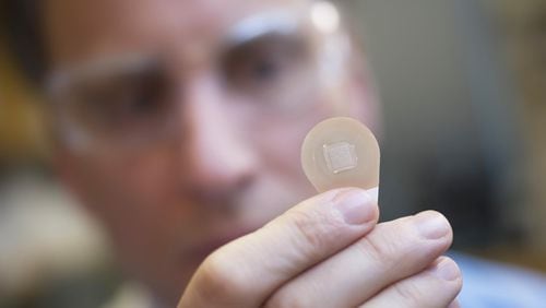Micron Biomedical co-founder Mark Prausnitz holds a microneedle patch. They could be available in a few years. CONTRIBUTED BY CHRISTOPHER MOORE / GEORGIA TECH