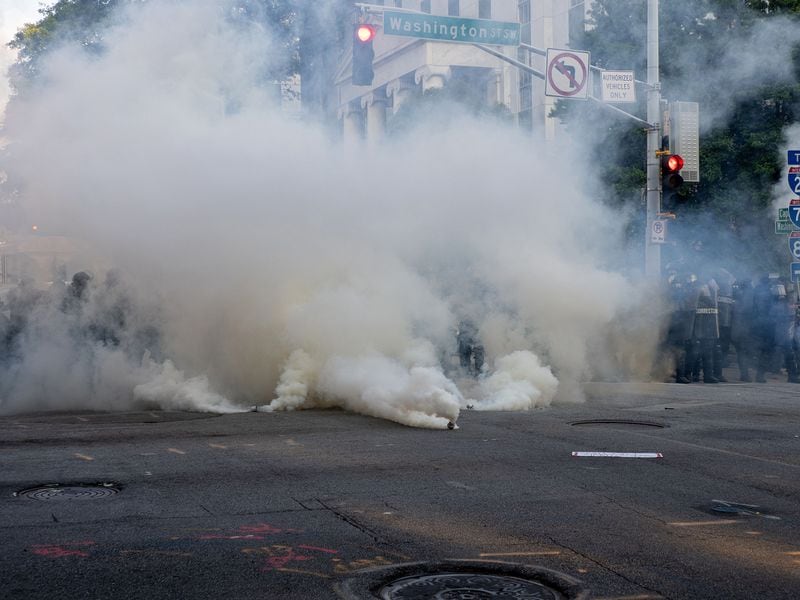 A cloud of tear gas engulfs protesters at the Capitol area on Tuesday, June 2, 2020. Contributed photo: John Ramspott