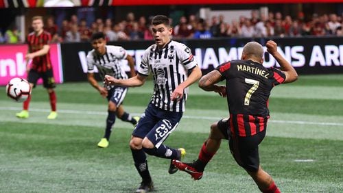 Atlanta United forward Josef Martinez scores a goal past Monterrey defender Johan Vasquex for a 1-0 lead during the second half in a Concacaf Champions league quarterfinal match on Wednesday, March 13, 2019, in Atlanta. Atlanta United won the match 1-0 but failed to advance.   Curtis Compton/ccompton@ajc.com