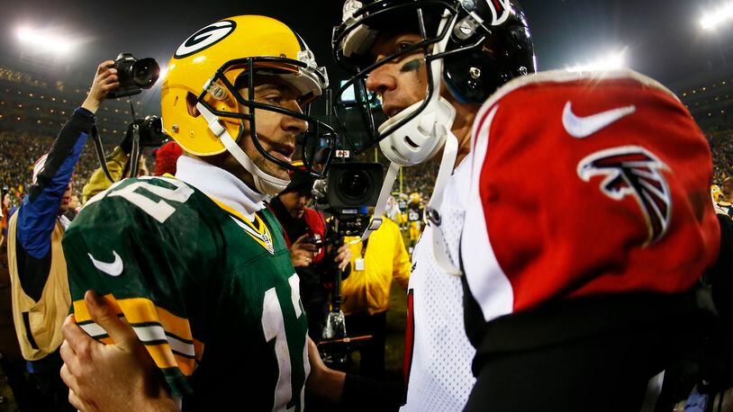 Green Bay's Aaron Rodgers and the Falcons Matt Ryan are pretty much head-to-head in late-season performance. (Kevin C. Cox/Getty Images)